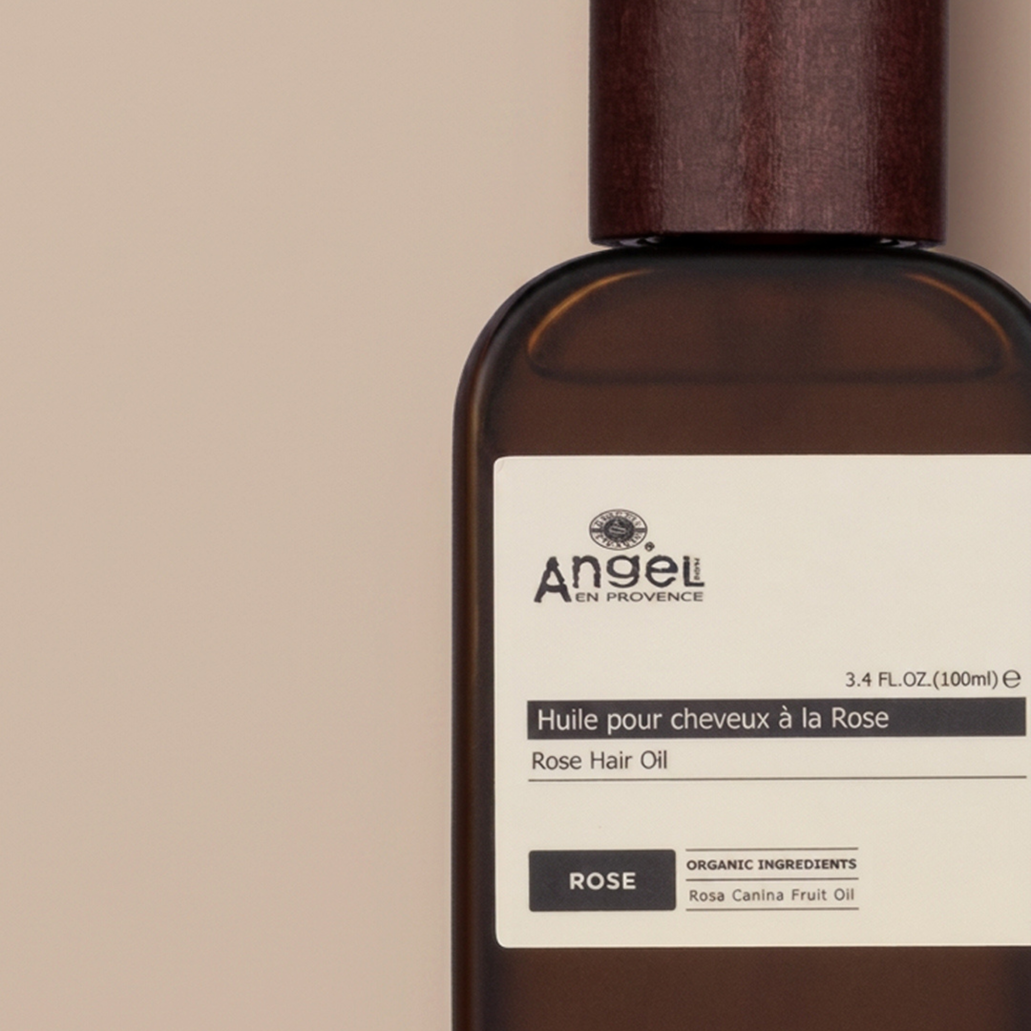 Angel Rose Hair Oil 100ml bottle with delicate rose-toned packaging and argan oil formula for hair repair