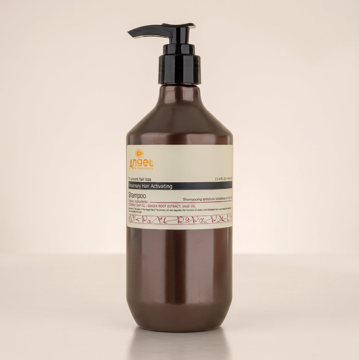A bottle of Angel en Provence Rosemary shampoo with a soft background from Angel Haircare NZ